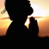 silhouette image of person praying